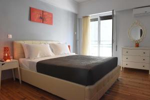 Katil atau katil-katil dalam bilik di Pnyka Apartment 1