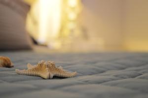 A bed or beds in a room at Stella Maris suite relax