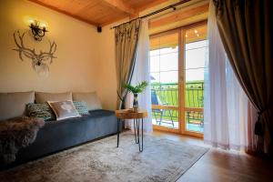 Posedenie v ubytovaní Folk Resort Domki i Apartamenty