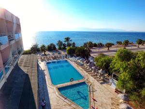 an overhead view of a swimming pool and the ocean at Çeşme Farm Hotel in Çeşme +63 photos