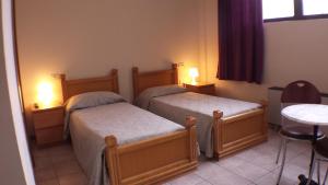 Posteľ alebo postele v izbe v ubytovaní Hotel Firenze 2000