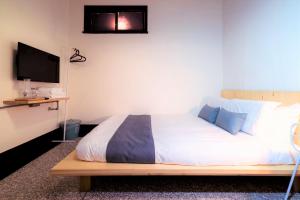 Krevet ili kreveti u jedinici u objektu With Inn Hostel