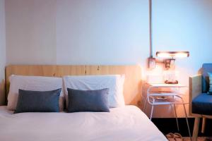 Krevet ili kreveti u jedinici u objektu With Inn Hostel