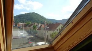 a view from a window of a town with a mountain at Pension im Glück Thale in Thale