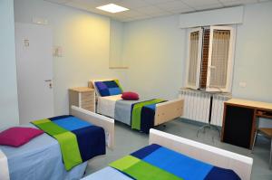 Postel nebo postele na pokoji v ubytování Albergo Rio