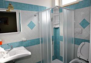 Koupelna v ubytování Albergo Rio
