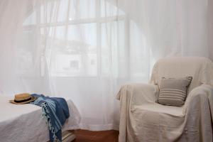 A bed or beds in a room at Eirinaki House