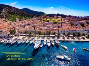 a group of boats are docked in a harbor at Apartments Ada Novak in Hvar