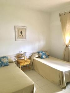 A bed or beds in a room at Casa Playa