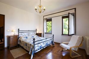 Postel nebo postele na pokoji v ubytování Casa Vista Isole Borromee