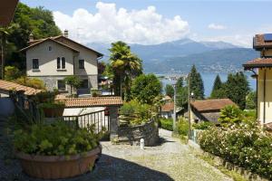 a small house with a view of the water at Casa Vista Isole Borromee in Stresa