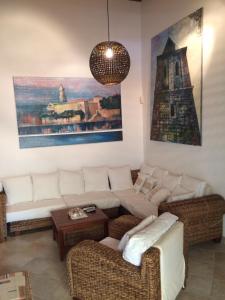 a living room with a couch and a table at Vila Ceder in Krk
