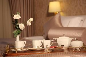 Postel nebo postele na pokoji v ubytování Grand Hotel & Spa Tirana