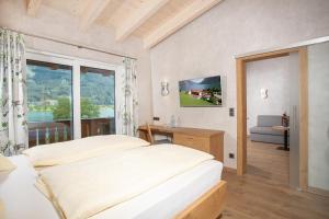 Letto o letti in una camera di Seehotel St Hubertus