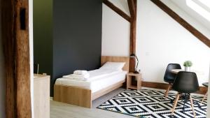 Postel nebo postele na pokoji v ubytování Arhiv Boutique House