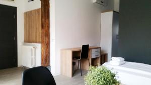 Postel nebo postele na pokoji v ubytování Arhiv Boutique House