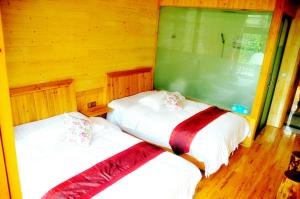 Cama o camas de una habitación en Yangjiajie Inn