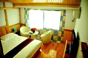 Cama o camas de una habitación en Yangjiajie Inn