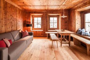 a living room with a couch and a table at Josephus in Senales