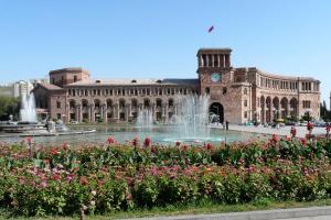 a building with a fountain in front of a building at Hostel Sakharov & Tours in Yerevan