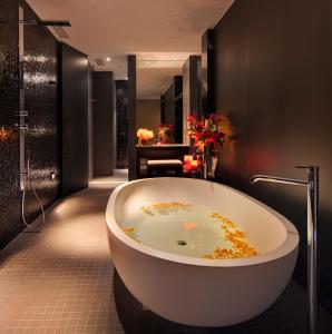 a bathroom with a large bath tub in a room at The Darling at The Star in Sydney