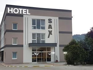 a hotel with a sign on the front of it at Hotel SAX Gračanica in Gračanica