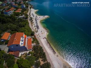 an aerial view of a beach next to the water at Apartments Marko in Trogir