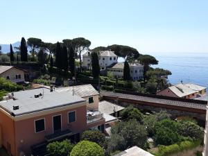 an aerial view of a town with the ocean at House Orizzonte - Casa Bianca in Genoa