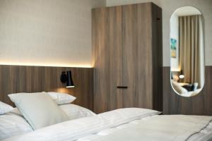 Postel nebo postele na pokoji v ubytování Hotel Rajka