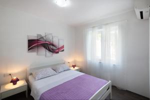 Postel nebo postele na pokoji v ubytování Green Paradise Apartments