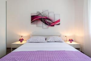 Postel nebo postele na pokoji v ubytování Green Paradise Apartments