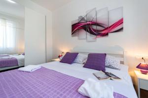 Postel nebo postele na pokoji v ubytování Green Paradise Apartments