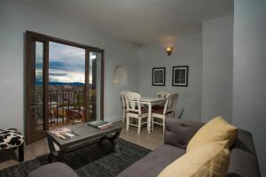 a living room with a couch and a table at Hotel Boutique El Palomar in San Miguel de Allende