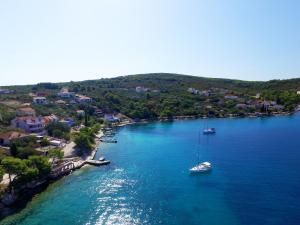 an aerial view of a harbor with boats in the water at Villa Paris in Nečujam