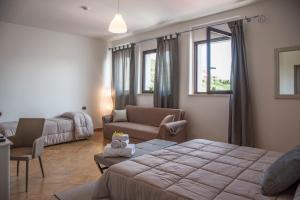 Ένα ή περισσότερα κρεβάτια σε δωμάτιο στο Villa Santadi