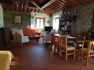 a living room with a table and a couch at Sweet in Chianti in Tavarnelle in Val di Pesa