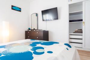 Posteľ alebo postele v izbe v ubytovaní Marina House Corralejo Center