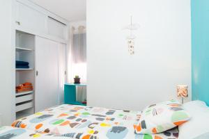 Posteľ alebo postele v izbe v ubytovaní Marina House Corralejo Center