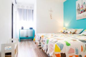 Posteľ alebo postele v izbe v ubytovaní Marina House Corralejo Center