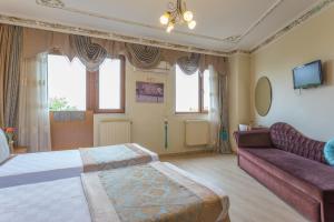 A bed or beds in a room at Seahouse Suites