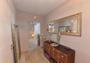 a bathroom with a sink and a mirror on the wall at Ferienwohnung Jill Schleiden in Schleiden