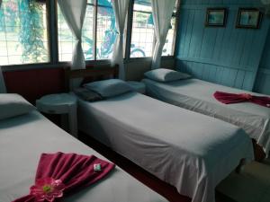 Ένα ή περισσότερα κρεβάτια σε δωμάτιο στο Hotel Margarita Sierpe