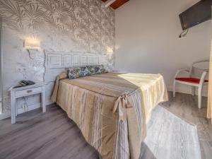 Кровать или кровати в номере Dulce Nombre Hotel - Apartamentos