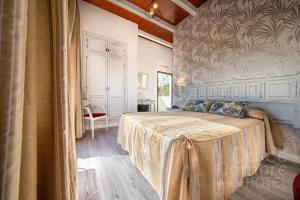 Кровать или кровати в номере Dulce Nombre Hotel - Apartamentos