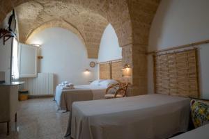 Postel nebo postele na pokoji v ubytování B&B La vecchia Corte