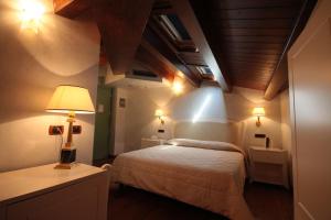 Postel nebo postele na pokoji v ubytování Hotel Rojan