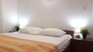 Postel nebo postele na pokoji v ubytování Apartman Kursar