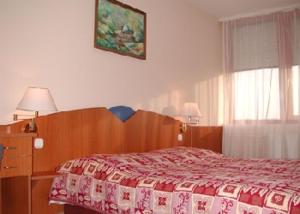 Postel nebo postele na pokoji v ubytování Hotel Napsugar