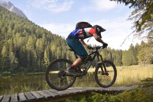 a person riding a bike on a bridge at Apart Waldegger in Nauders