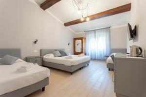 Giường trong phòng chung tại Santo Spirito Venti